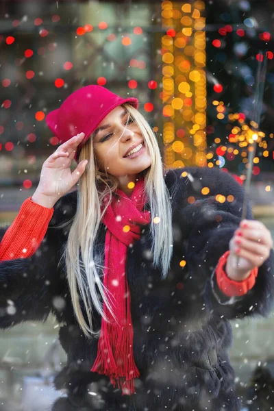 Positive Blond Woman Having Fun Sparkling Lights Christmas Fair — Stock Photo, Image