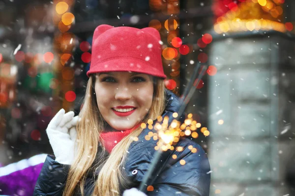 Cheerful Blond Woman Wears Red Hat Playing Bengal Lights Holiday — Stock Photo, Image