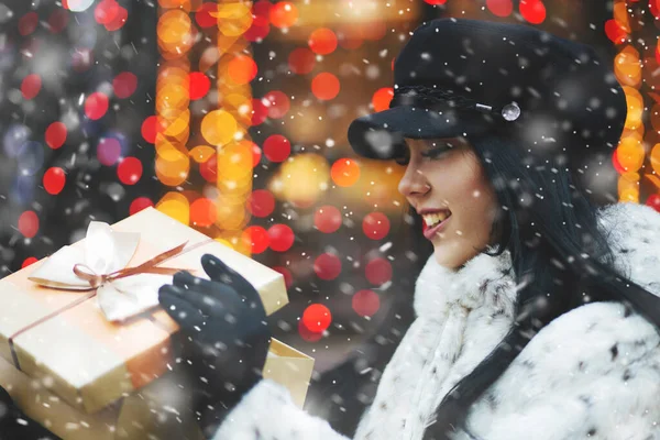 Charming Brunette Woman Receiving Gift Holiday Fair Snowfall Empty Space — Stock Photo, Image