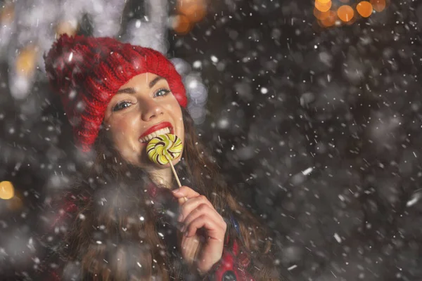 Pretty Young Woman Eating Candy Christmas Market Empty Space — Stock Photo, Image