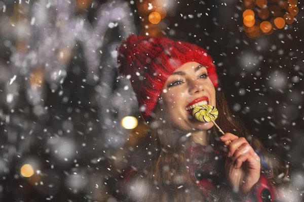 Beautiful Young Woman Eating Candy Christmas Market Empty Space — Stock Photo, Image