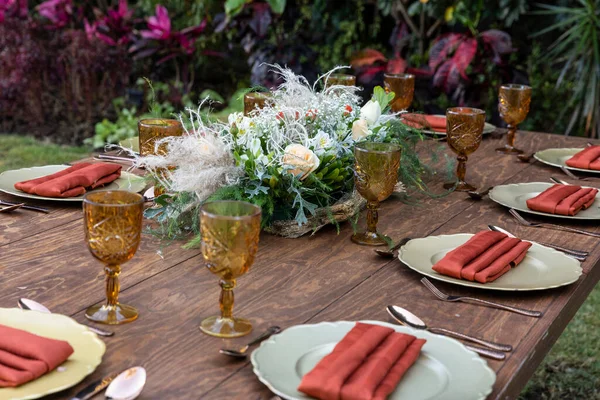 Elegant table in the garden with service to receive guests for social events or civil wedding.