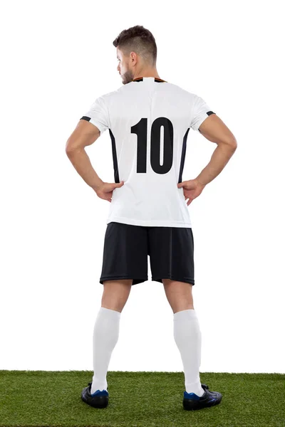 若いです男ドイツのプロ選手から後ろで番号10で白い制服で草と白の背景 — ストック写真