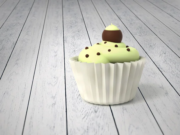 Cupcake cadeau avec crème pistache et boules de chocolat sur bois blanc froid — Photo