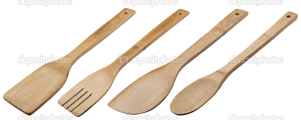 Wooden spoons on light gray background