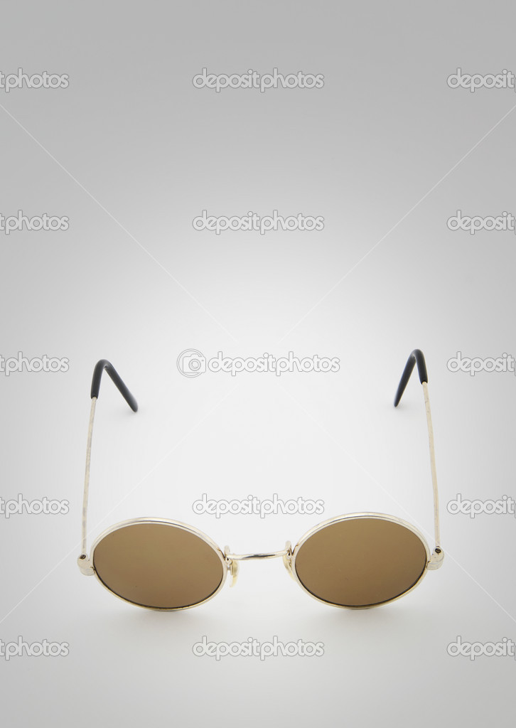 Retro round sunglasses on white background