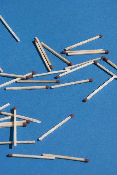 Matches on light blue background — Stock Photo, Image