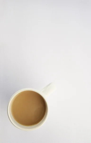 Hrnek na kávu cappuccino zázemí, nad zobrazením — Stock fotografie