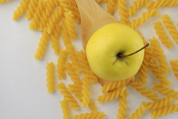 Apple and rotini pasta — Stock Photo, Image