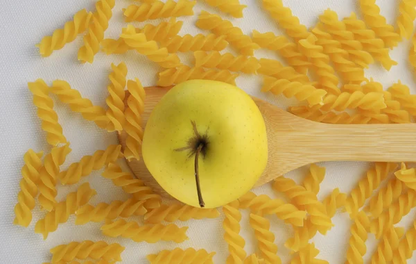 Apple and rotini pasta — Stock Photo, Image