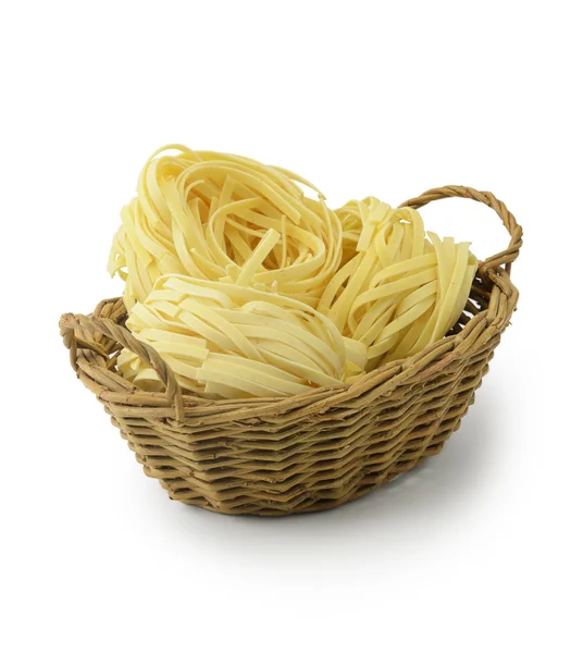 Tagliatelle pasta in basket — Stock Photo, Image