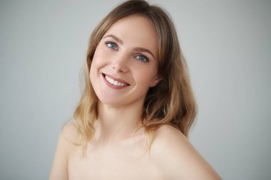 Portrait of beautiful lovely woman with wide smile on white backlground 