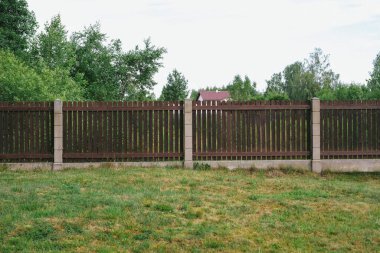 Privacy and security concept. Close-up view of brown wooden fance