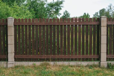 Privacy and security concept. Close-up view of brown wooden fance
