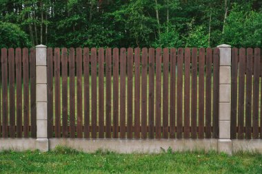 Privacy and security concept. Close-up view of brown wooden fance