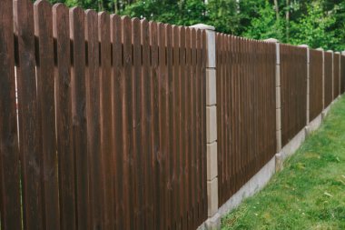 Privacy and security concept. Close-up view of brown wooden fance