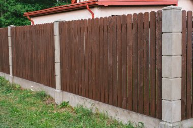 Privacy and security concept. Close-up view of brown wooden fance