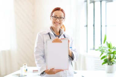 Hospital and medicine concept, woman doctor using tablet