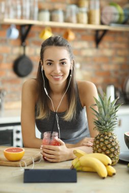 Beautiful woman food vlogger having fun in the kitchen