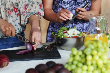 People preparing food for picnic