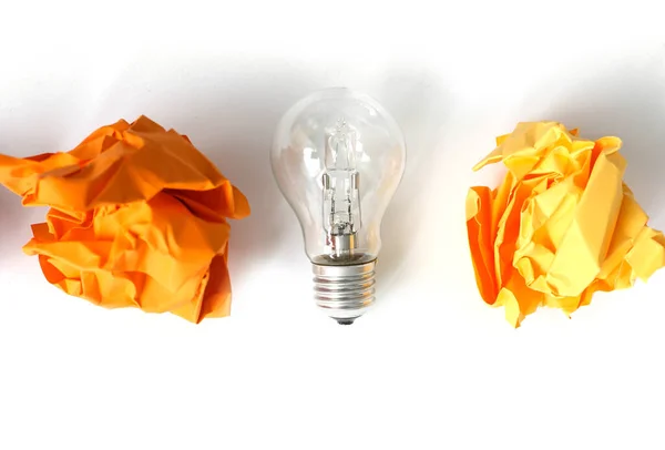 Crumpled Orange Paper Light Bulb White Background — Photo