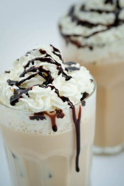 Delicious latte with whipped cream and chocolate on top