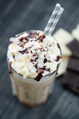 Delicious latte with whipped cream and chocolate on top
