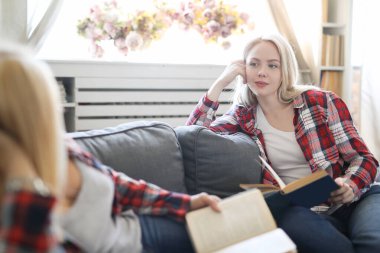 tender image of mother and daughter posing at home