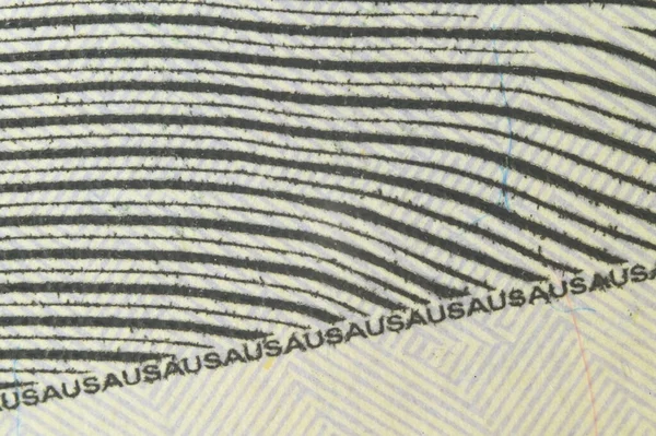 Inschrift der USA in sehr kleiner Schrift als Schutzgrad auf einer Banknote von hundert US-Dollar eines neuen Musters - Nahaufnahme — Stockfoto