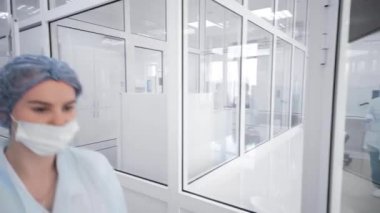 group of employees and scientists of a modern biochemical laboratory doing tests and analyzes in their medical offices