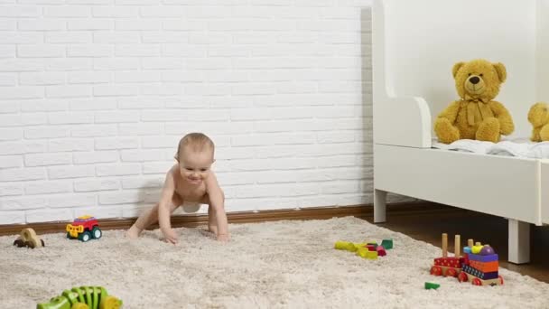 Baby Boy Disposable Diaper Takes First Steps Barefoot Carpet Background — Video
