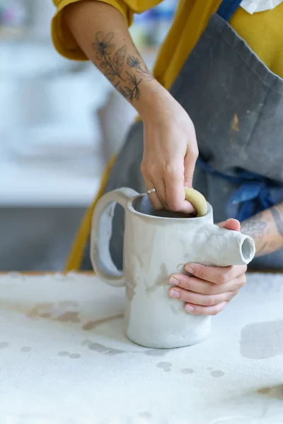 Young sculptor girl create ceramic tableware in studio. Woman pottery artist work with wet clay — Stock Photo, Image