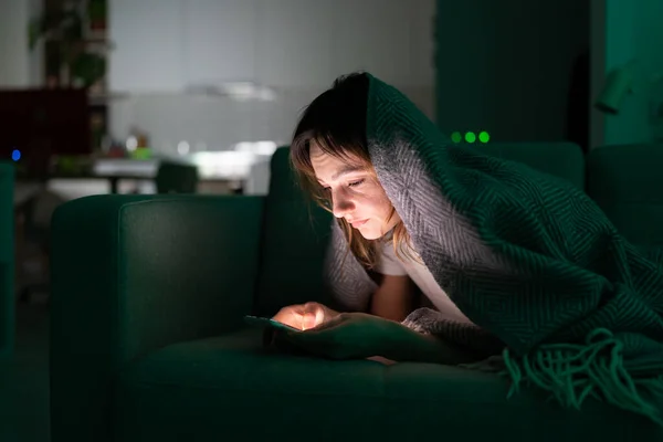Addicted from social media woman surf internet in dark room at night. Sleep disorder problem concept — Stockfoto