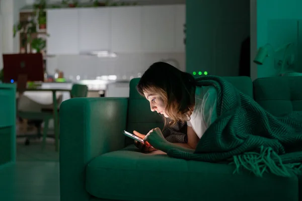 Addicted from social media woman surf internet in dark room at night. Sleep disorder problem concept — Stock fotografie