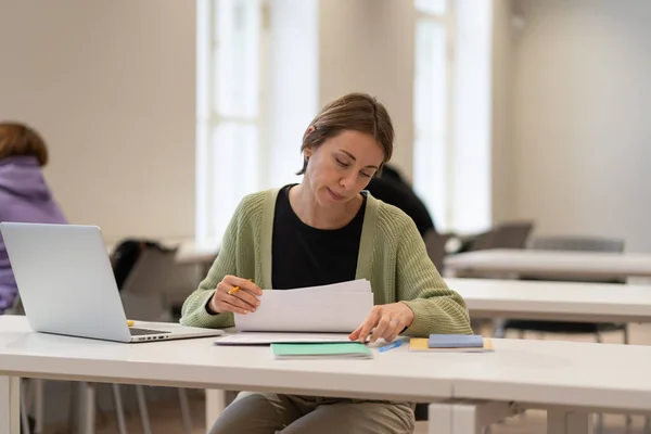 Focused Hard Working Middle Aged Female Student Reading Architectural Drawings — Photo