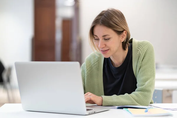 Smiling Middle Aged Woman Typing Laptop While Studying Online Library — Stockfoto