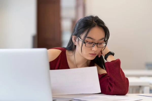 Focused Hard Working Asian Student Girl Glasses Reading Architectural Drawings — Stockfoto