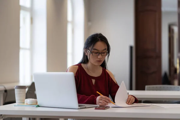 Focused Asian Female Student Sitting Library Desk Laptop Preparing Exam — Stockfoto