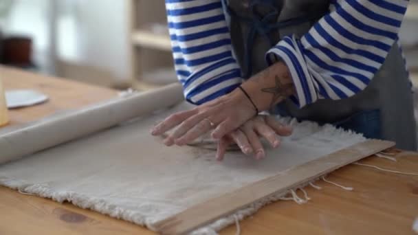 Master Pottery Wearing Apron Wedging Clay Hands Using Electric Potters — Video Stock
