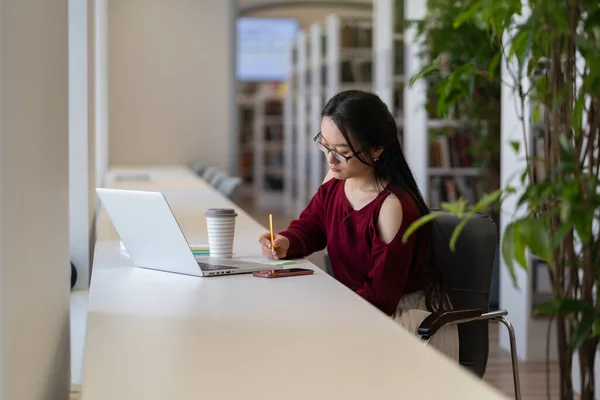 Smart Student Girl Sit Desk Make Notes Laptop Search Read — Stockfoto