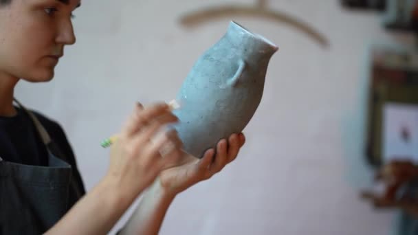 Young Serious Skilled Woman Artisan Clay Blue Vase Pencil Painting — Stockvideo