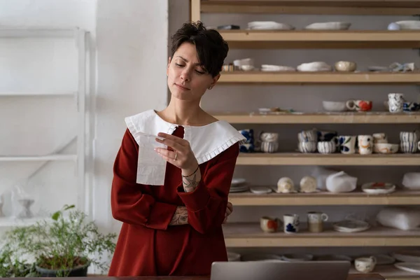 Upset Craftswoman Pottery Studio Owner Looking Receipt Worried Facial Expression — Foto Stock