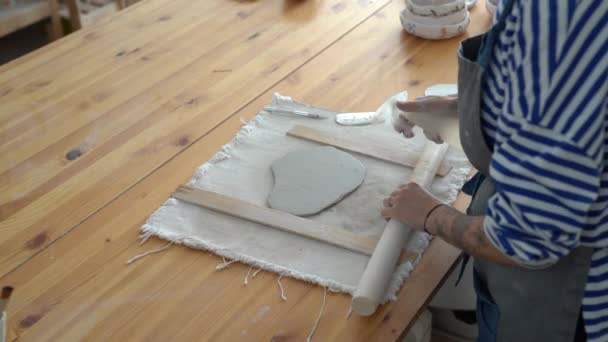 Woman Ceramist Spraying Piece Clay Water Rolling Out Wooden Table — Vídeo de stock
