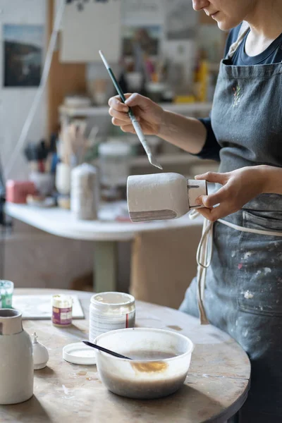 Young Craftswoman Black Apron Paints Clay Vase Paintbrush Baking Handmade — Foto de Stock