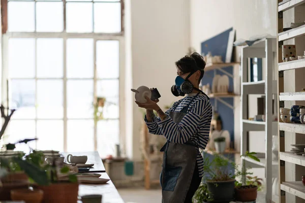 Professional Ceramist Italian Woman Wearing Respirator Polishing Mug Workshop Studio — Foto de Stock