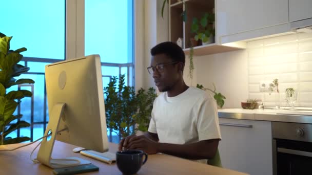 Young Black Freelancer Stays Late Working Computer Remotely Home Sitting — Stockvideo