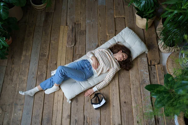 Young Peaceful Woman Sleeping Wooden Floor Resting Using Helmet Female — Stock fotografie