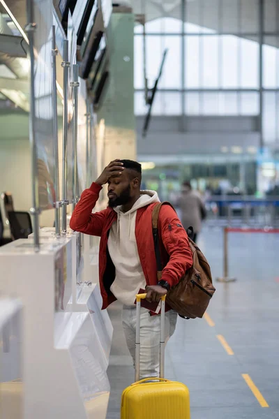Upset Depressed African American Man Luggage Standing Check Counter Airport — Stockfoto