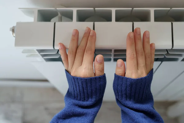 Closeup Woman Warming Her Hands Heater Home Cold Winter Days — Stock Fotó