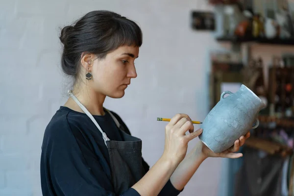 Young Serious Skilled Woman Artisan Clay Blue Vase Pencil Painting — Stockfoto